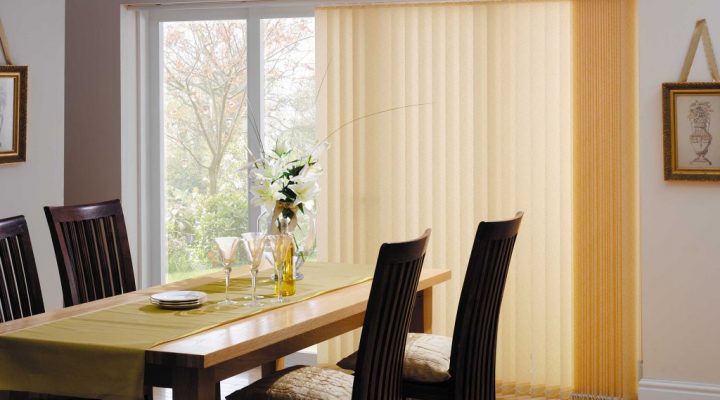 Dining room with dining table with vertical blinds