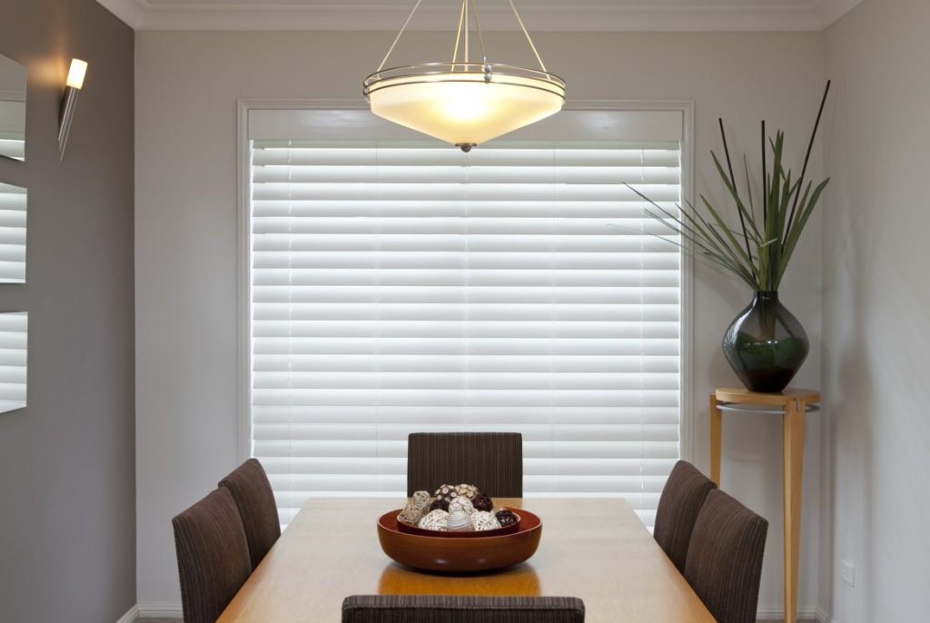 Venetian blinds in a dining area enhancing the space and controls the light that comes in